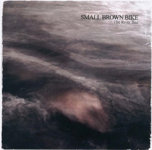 SMALL BROWN BIKE/RIVER BED